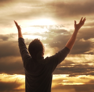 Man LIfint Hands in Praise