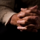 Black hands in prayer